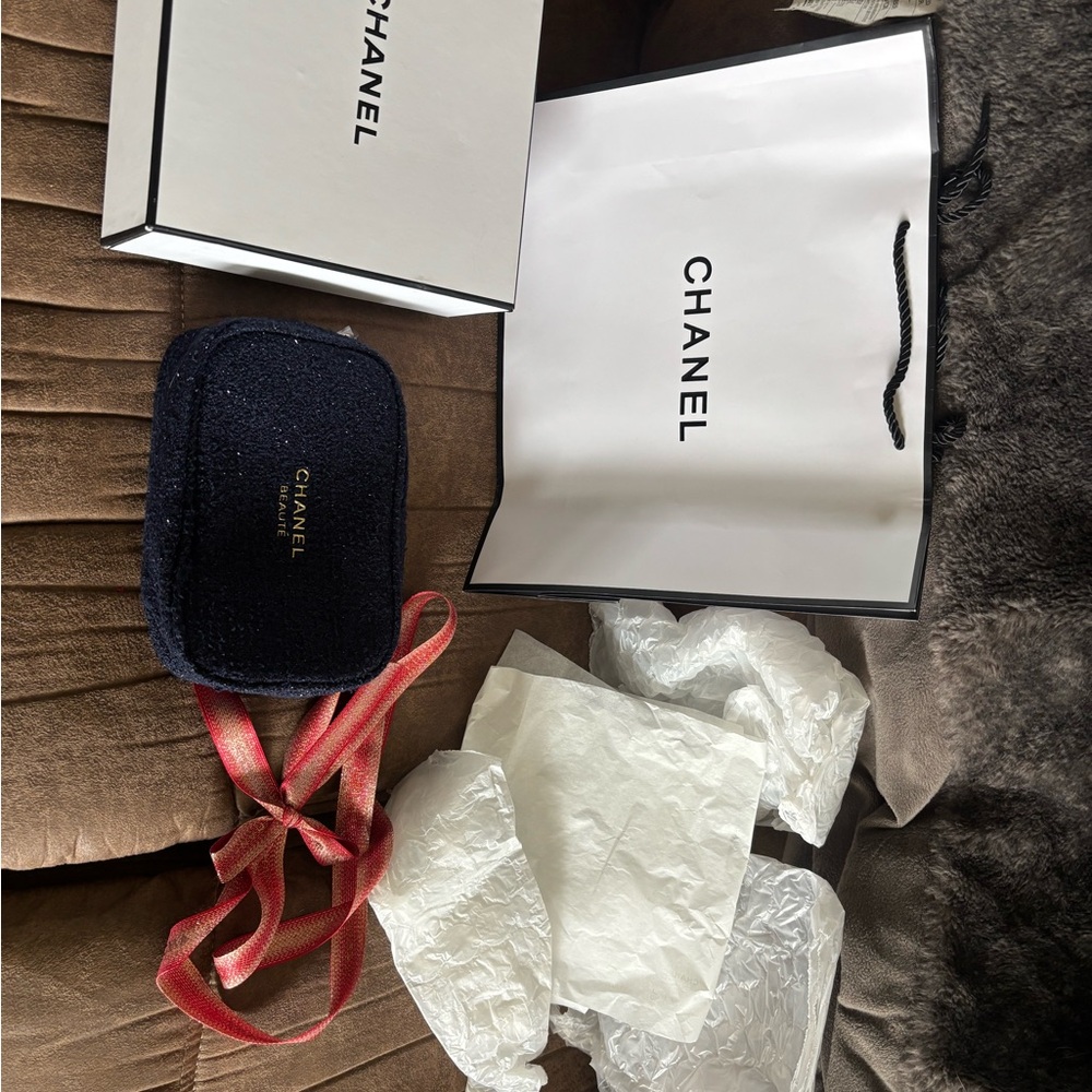 CHANEL Navy Tweed Pouch with Gold Logo and Red Ribbon